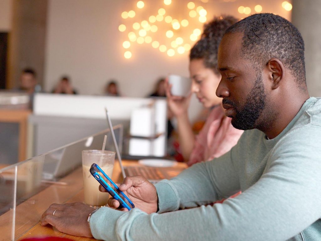 man looking at cell phone